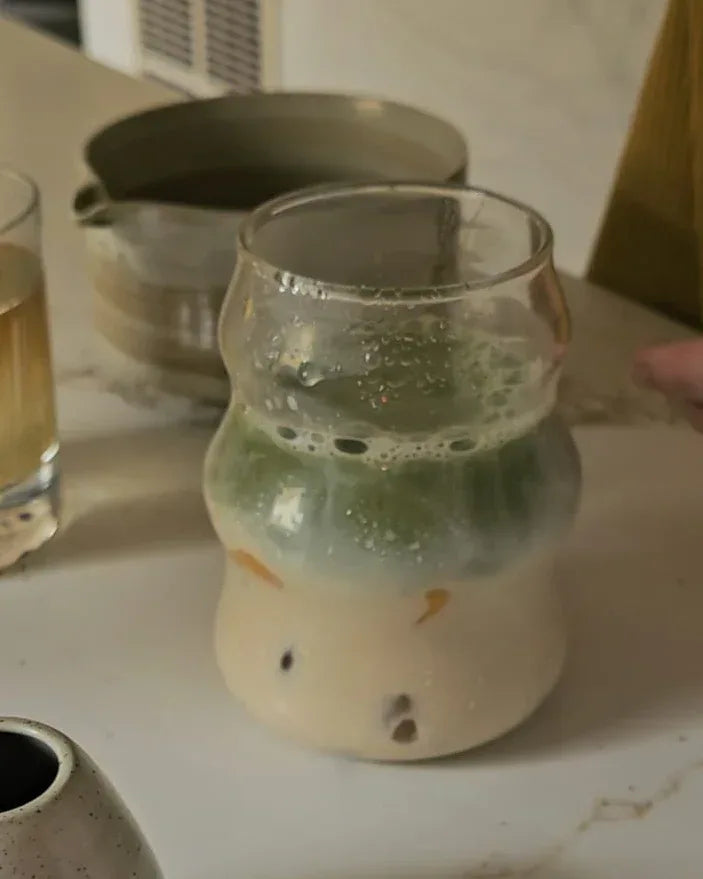 Ceramic jars with different contents on a marble surface